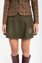 FALDA DE LANA VERDE CON ESCUDO