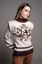 CREAM SHOULDER PAD SWEATER WITH CREST